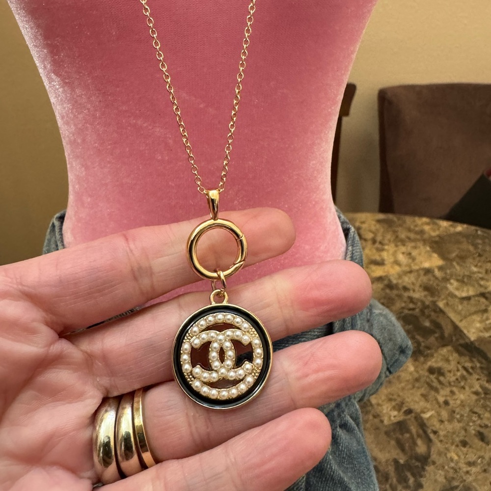 Unique one of a kind monogram Pendant on a gold plated necklace.
